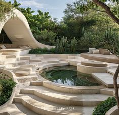 an outdoor fountain with steps leading up to it