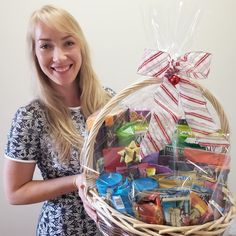 a woman holding a basket filled with candy