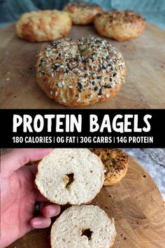 a person holding a bagel on top of a wooden cutting board with the words protein bagels above it