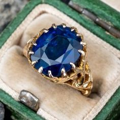 This stunning ring is centered with an oval mixed cut sapphire, weighing 6.22 carats in a multi-prong setting. The lower gallery and shoulders are accented with a pierced design. The ring measures 12.9mm at the top, rises 6.1mm above the finger, tapering to 2.6mm wide and 1.0mm thick at the base of the shank. The ring is currently a size 3.5 and we offer complimentary sizing to fit. Luxury Gold Sapphire Ring, Luxury Everyday Yellow Gold Sapphire Ring, Timeless Luxury Yellow Gold Sapphire Ring, Engagement Rings Blue, Blue Sapphire Engagement Rings, Oval Sapphire Engagement Ring, Green Montana, Ruby Diamond Ring, Zodiac Sign Virgo