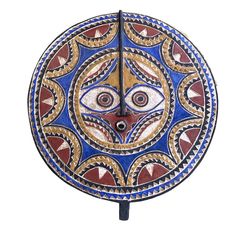 a decorative clock with an evil eye on it