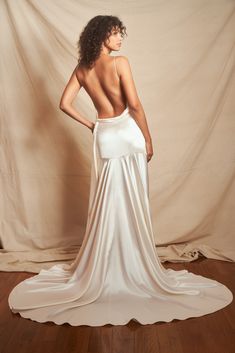 the back of a woman in a white dress