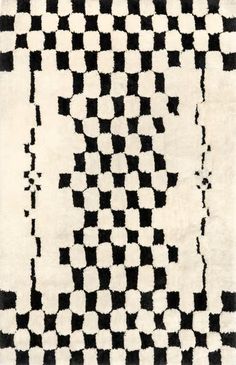 a black and white rug with squares on the bottom, in different sizes and colors