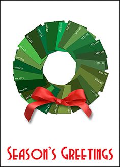 the season's greetings card features a green wreath with red ribbon on it