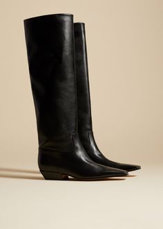 The Marfa Knee-High Boot in Black Leather– KHAITE Luxury Knee-high Boots With Square Toe For Fall, Luxury Square Toe Knee-high Boots For Fall, Luxury Fitted Square Toe Knee-high Boots, Luxury Fitted Knee-high Boots With Square Toe, Fitted Mid-calf Boots With Leather Sole And Square Toe, Fitted Mid-calf Boots With Square Toe And Leather Sole, Luxury Calf Leather Knee-high Boots With Square Toe, Luxury Knee-high Boots With Sculpted Heel And Square Toe, Fitted Calf Leather Knee-high Boots With Square Toe