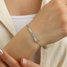 ✅ Personalization: This beautiful bracelet features a classic font that creates a beautiful, perfectly balanced look when worn. Simply select your desired engraving and our skilled craftsmen will take care of every detail, creating a personalized bracelet that you can proudly wear yourself or give as a gift. ✅ Dimensions: plate: 4 mm x 24 mm, length: 16 + 3 cm adjustable, ✅ PERFECT GIFT IDEA: If you are looking for an original gift, this exclusive bracelet is just the thing. No matter whether it Customized Minimalist Nameplate Bracelet, Customized Silver Name Bracelet In Trendy Style, Trendy Customizable Silver Name Bracelet, Personalized White Gold Name Bracelet As Gift, Personalized Dainty White Gold Name Bracelet, Personalized White Gold Dainty Name Bracelet, Dainty Personalized White Gold Name Bracelet, Minimalist Personalized Nameplate Bracelet, Adjustable White Gold Name Bracelet For Personalized Gift