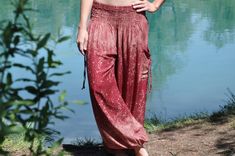 super comfortable pants with 2 pockets❖ material ❖100 % viscose❖ one size ❖length (measured outside): 100 cmelastic waist: 60 cm - 120 cmloose elastic band at the ankles Red Festival Pants With Elastic Waistband, Red Harem Pants With Pockets For Spring, Red Harem Pants For Spring With Loosely Fitted Hips, Spring Red Harem Pants With Loosely Fitted Hips, Red Hippie Summer Pants, Summer Red Hippie Pants, Red Hippie Pants For Summer, Red Elastic Waistband Bottoms For Festival, Red Bottoms With Elastic Waistband For Festivals