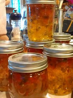 jars filled with food sitting on top of a counter