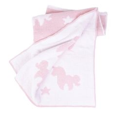 a pink and white blanket on top of a white surface with an animal design in the middle