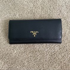 Authentic Prada Saffiano Wallet In Red, Black And Cream Interior/Lining. Excellent Condition. Luxury Saffiano Leather Wallets For Everyday Use, Luxury Saffiano Leather Wallet, Luxury Saffiano Leather Wallet For Evening, Elegant Evening Wallet In Saffiano Leather, Elegant Saffiano Leather Wallet For Evening, Elegant Saffiano Leather Evening Wallet, Elegant Clutch Bag With Rfid Blocking, Designer Black Saffiano Leather Wallets, Elegant Clutch With Rfid Blocking