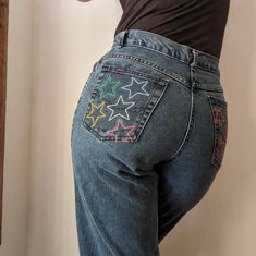 "Original Reworked Rainbow Star Jeans by Sensible Slacks. A pair of vintage high rise Chic jeans reworked with embroidered rainbow stars on the back pockets. Back pockets are fully functional. Jeans are 100% cotton, made in Mexico. Marked a size 10 petite- 30\" waist, 12\" rise, 42\" hips, 29.5\" inseam, 12\" leg opening. In great vintage condition with only light wear throughout." Embroidery Back Pocket Jeans, Star Embroidered Jeans, Easy Embroidery Jeans, Jeans Back Pocket Embroidery, Star Embroidery Jeans, Embroidered Jean Pockets, Stars On Jeans, Embroidered Jeans Pocket, Embroidery Designs Jeans