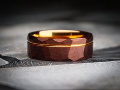 a close up of a wedding ring on a table