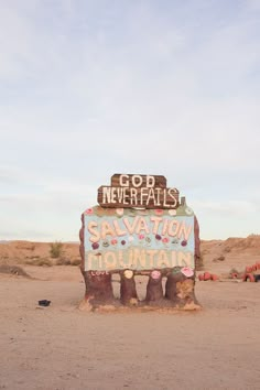 a sign in the middle of nowhere that says god never falls salvation on it's side