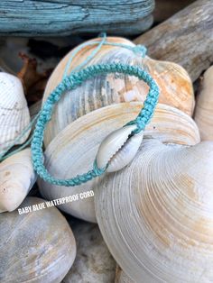 "I love the simplicity of this single cowrie shell bracelet hand knotted onto either cotton cord or waterproof polyester cord. It's just perfect for any beach lover Wear the sea on your wrist! Pretty glass seed beads will be on the closure strings. The first photo shows the addition of 2 wood beads with the cowrie shell on beige cotton cord. If you prefer the bracelet without the wood beads just leave me a message in the notes to seller section:) I hope this bracelet keeps the sea close to your Adjustable Ocean-inspired Friendship Bracelets, Bohemian Beaded Bracelets With Nylon Cord For Beach, Handmade Adjustable Shell Friendship Bracelets, Casual Beach Friendship Bracelets With Sliding Knot, Casual Friendship Bracelets With Sliding Knot For Beach, Summer Beach Macrame Braided Bracelets, Adjustable Braided Nylon Cord Bracelet For Beach, Adjustable Nylon Cord Braided Bracelet For Beach, Adjustable Beachy Turquoise Friendship Bracelets