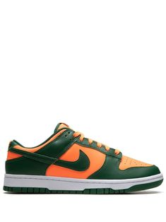 Shop Nike Dunk Low "Miami Hurricanes" sneakers Nike Tenis, Nike T, Nike Sb Dunks Low, Team Uniforms, Nike Sb Dunks, Sb Dunk, November 1, Swoosh Logo, Orange Leather