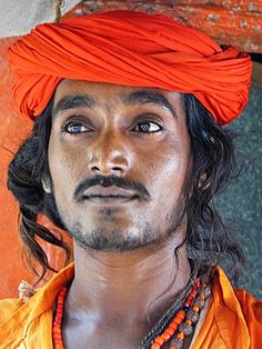 a man with an orange turban on his head