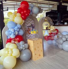 balloons and cheese are on display at a birthday party