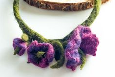 Felt Necklace Flowers hugging your neck? Why not. This beautiful and unique necklace will add charm and beauty to many of your styles. It captivates with its hues and enchants with its design.  Beautifully unique, this necklace is 100% hand-made from worsted wool and is felted wet. Composed with care over every detail. This necklace is very light and soft. Additional information Weight 16 g 0.57 ounces Lenght 48 cm 18.9 inch Felt Flower Necklace, Wool Jewelry, Neck Necklace, Felt Necklace, Floral Pins, Purple Necklace, Felt Flower, Hand Felted, Felted Wool