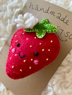 a close up of a strawberry on a card