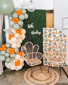 an arrangement of balloons and chairs are on display