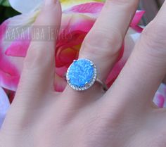 STUNNING Lab Opal CZ SOLID sterling stamped 925 silver Tarnish free sizes 4-11 4 5 6 7 8 9 10 11 Some sizes are sold out. But will be replenished shortly Top of ring height: 14.4mm / width: 12.8mm Shank width: 1.5mm lab created opal & clear cubic zirconia Center stone size: 11.8mm x 10.0mm Stone shape: Oval Total number of CZ stones: 28 Stone setting: Prong High Polished, solid 925 sterling silver. Rhodium plated to prevent tarnishing. TARNISH FREE Rhodium plated to avoid tarnishing Nothing but the best from my custom jewelry store. Email me if you have any questions. Opal Halo Ring As Gift, Opal Halo Ring For Gift, Opal Halo Rings As Gifts, Opal Halo Rings For Gifts, Opal Halo Jewelry As Gift, Opal Rings With Halo Setting As A Gift, Opal Jewelry With Halo Setting For Gift, Silver Halo Design Rings As A Gift, Silver Rings With Halo Design As Gift