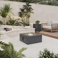 an outdoor living area with furniture and plants