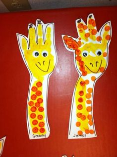 two giraffes made out of construction paper