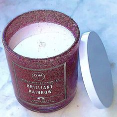 a candle that is sitting next to a container