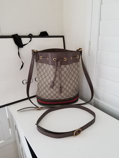 Gucci Bucket Bag - (does not come with Gucci Bag or extra strap) 10" W x 12"H x 5" D 100% Authentic Made in Italy  Interior is linen - has staining from meds when I travelled overseas - easy clean/press LAYAWAY Available until Jan 2025 - I ask for a 25% deposit and every 2 weeks you pay a portion. If you miss paying every two weeks, you forfeit/cancel the sale, and I keep all money paid until that date. Please ask me ahead of time if that works for you. Store Policy: NO RETURNS ACCEPTED - All sa Gucci Leather Bucket Bag With Removable Pouch, Luxury Gucci Bucket Bag, Gucci Brown Bucket Bag, Gucci Luxury Bucket Bag With Removable Pouch, Gucci Bucket Bag, Gucci Bucket Bag With Gold-tone Hardware For Travel, Italy Interior, Clean And Press, Drawstring Bucket Bag