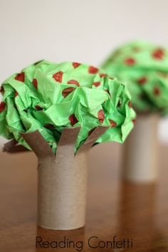 two vases made out of toilet paper on a table