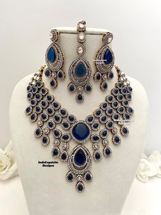 Elegant Bollywood style Victorian Monalisa stones necklace comes with statement Earrings and Tikka/ Indian Jewelry/Premium Quality Polki and Kundan Jewelry/Navy blue  All items are shipped from Brampton, Ontario, Canada. If you need your item by a certain day, please reach out to us for express delivery option before placing the order so that we can update the shipping for you. Standard shipping/delivery timeline Below are the delivery timeline estimates. We dispatch all orders by the next busin Traditional Blue Bridal Necklace For Formal Occasions, Blue Hand Set Jewelry Sets For Wedding, Hand Set Blue Jewelry Sets For Wedding, Blue Hand Set Jewelry For Wedding, Heavy Blue Jewelry For Formal Occasions, Heavy Blue Chandbali Jewelry Sets, Wedding Blue Hand Set Jewelry Sets, Blue Formal Jewelry With Stone Work, Formal Blue Jewelry With Stone Work