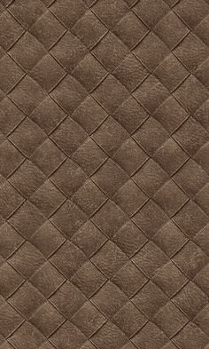 an up close view of a brown leather textured material with small squares on it