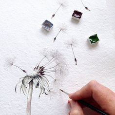 someone is drawing a dandelion with colored pencils and watercolor paints on paper