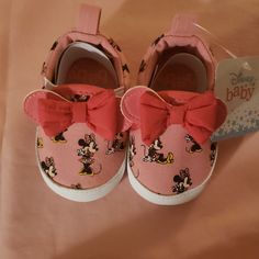 For Sale Are These Never Worn In The Box Disney Minnie Mouse Baby Girl Shoes. They Are So Cute And Would Look Great With Just About Any Outfit. The Color Is Pink With Minnie Mouse Printed On Shoe. They Are Slip Ons So Easy To Get Off And On. The Size They Fit Are 3 To 6 Months. Pink Disney Sneakers With Round Toe, Disney Pink Round Toe Sneakers, Pink Minnie Mouse Low-top Sneakers, Casual Pink Minnie Mouse Sneakers, Cute Minnie Mouse Sneakers With Round Toe, Cute Minnie Mouse Low-top Sneakers, Minnie Mouse Sneakers With Round Toe In Synthetic, Minnie Mouse Synthetic Sneakers With Round Toe, Shoes Disney