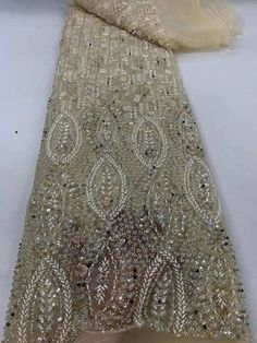 This high quality Fabric is measured in 5 Yards With Embroidered Beading and Sequin. It is soft, very delicate and beautiful. This high Quality Fabric is made with Fashion embroidered rhinestones can be used in making party wedding dresses, skirts, shawls, scarves and other other fashion apparels as you would like. Size : Length : 5 yards (180 inch). Width: 50 inch (Please allow slight deviation for the measurement data ,±1 inch) Material: 100% Polyester, Tulle Lace Fabric, Eco-Friendly embroidery Tulle Lace, Champagne Gold, Wedding Party Dresses, Lace Fabric, Luxury Fabrics, Dress Making, Quality Fabric, Shawl, Wedding Party