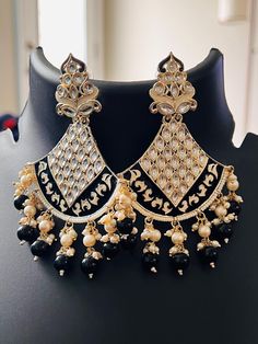 Kundan Meenakari earrings all Blouses come with margin inside for resizing / customization, please leave a message Luxury Round Meenakari Earrings, Luxury Kundan Meenakari Chandelier Earrings, Luxury Meenakari Bridal Dangle Earrings, Luxury Designer Cutdana Earrings, Traditional Dangle Pearl Earrings, Traditional White Pearl Earrings, Traditional Pierced Pearl Drop Earrings, Traditional White Pearl Pierced Earrings, Meenakari Black Jewelry For Gift