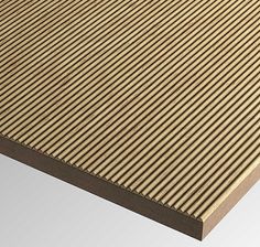 a close up view of a wooden table top with vertical slats on the surface