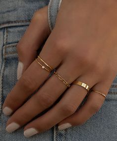 14k gold filled & made to live in. This smooth round band provides ultimate comfort & a true to size perfect fit. 3 tiny diamond replica cz pavé set stones give a beautiful sparkle. 1.2mm band Dainty Gold Rings Aesthetic, Gold Ring Inspiration, Silver Ring Inspiration, How To Style Rings On Both Hands, Classy Ring Stack, Ring Layering, Stacking Ring, Ring Stack Ideas, Dainty Ring Stack