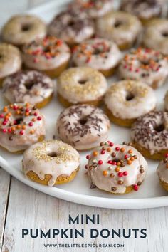 a plate full of mini pumpkin donuts with sprinkles on them and the title overlay reads mini pumpkin donuts