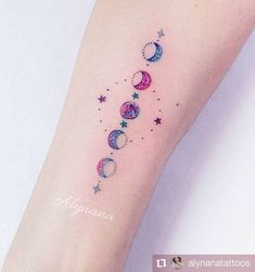 a woman's arm with the word aquarius on it and stars in the sky