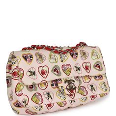 This Small Flap Bag is in Multicolor canvas with silver tone hardware and features a coco heart motif print, front flap with CC turnlock closure, and adjustable interwoven antique gold tone chain link shoulder/crossbody strap.The interior is lined in white fabric and has one zip pocket with a Chanel pull on the rear wall.Collection: 10-series (2005-2006)Origin: FranceCondition: ; Excellent - This bag retains its structure. There is some minor wear on the exterior canvas including some rubbing. There is no plastic on the hardware which shows some light scratching most noticeable on the turnlock. The interior shows some negligible signs of wear including minor discoloration. The serial sticker remains intact.Accompanied by: Chanel dustbagMeasurements: 9" width x 6" height x 2.5" depth; 16.5" Chanel 2024, Heart Motif, Vintage Valentines, Vuitton Bag, Sierra Leone, Valentine Heart, Printed Bags, Vintage Chanel, White Fabric