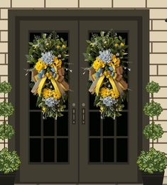 two wreaths with yellow and blue flowers are on the front doors of a house