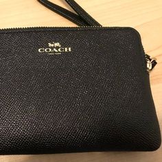 Coach Brand Wallet Clutch New With Tags Leather Coach Purse Wristlet Wallet Approx 6 3/8" X 4" X .5" Black Pebble Pattern On The Outside Black Fabric Inside 1 Main Compartments With 1 Tiny Side Compartments Formal Clutch Wristlet With Zipper Closure, Coach Elegant Wallet With Cell Phone Pocket, Elegant Coach Wallet With Cell Phone Pocket, Formal Wristlet With Zipper Pouch, Elegant Coach Coin Purse With Zipper, Coach Evening Pouch Clutch, Coach Evening Clutch Wallet, Coach Formal Pouch Wallet, Classic Formal Wristlet With Zipper Closure