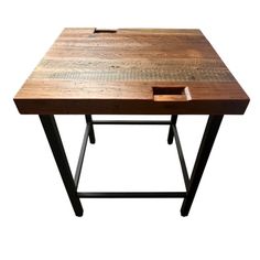 a wooden table with metal legs and an open drawer