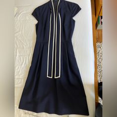 Never Worn, Size 00. Wool Dress Classic Blue Midi Dress For Spring, Navy Fitted Dress For Daywear, Fitted Navy Dress For Daywear, Career A-line Dresses, Elegant Navy Spring Dresses, Navy Midi Dress For Spring Workwear, Classic Navy Spring Dress, Spring Career V-neck Dress, V-neck Spring Career Dresses