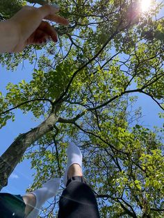 two people reaching up into the sky with their hands