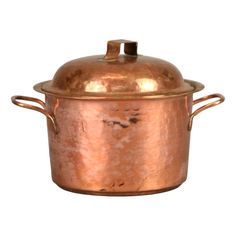 an old copper pot with a lid is shown on a white background and there is no image to describe