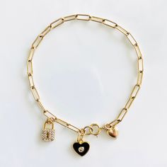 Loving these new heart charm bracelets. Something about them reminds me of the playfulness of childhood, but with an updated elegant (and adult) twist. These enamel charms are available in red, light pink, white, and black, and are all accented with a cubic zirconia. Charm also available in a cubic zirconia heart. If you like the looks of how some are styled in the pictures with multiple charms, please contact me for a customizable bracelet. Otherwise, each bracelet comes with 1 charm. Charms ar Dangle Charms Bracelets For Friendship, Dangle Bracelets With Charms For Friendship, Dainty Adjustable Charm Bracelet With Heart Charm, Trendy Jewelry With Removable Charms For Friendship, Dainty Heart Charm Jewelry For Friendship, Dainty Charm Bracelet With Removable Charms For Gift, Trendy Dangling Charms Jewelry For Friendship, Everyday Dangle Charms Bracelets, Dainty Charm Bracelet As Gift