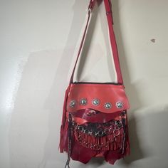 Here Is A Stunning Handmade Supple Leather Boho Southwest Hobo Long Fringe Crossbody Bag, This Opens To A Roomy Deep Compartment That Is Fully Lined With One Inside Zippered Pocket Made From Clean New Material. The Front Is Adorned With Silver Toned Metal Conchos. The Adjustable Strap And Fringe Are Made From Matching Leather. The Pictures Do Not Do Justice, You Will Be Astounded With Your New Show Stopping Bag! This Is A New Never Used Handmade Piece, Made Entirely In A Smoke Free Home In Maryl Red Satchel Shoulder Bag With Palladium Hardware, Red Shoulder Bag With Silver-tone Hardware For Evening, Red Evening Shoulder Bag With Silver-tone Hardware, Red Leather Festival Bag, Red Satchel Shoulder Bag With Silver-tone Hardware, Red Festival Bag With Removable Pouch, Red Bag With Removable Pouch For Festival, Red Satchel Shoulder Bag For Festival, Red Festival Bag With Adjustable Strap