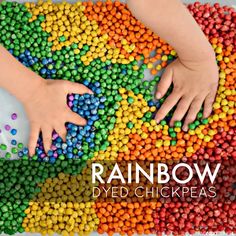 two hands touching each other on top of a rainbow colored chickpeas with the words rainbow written above it